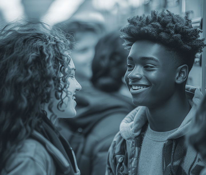 Two young graduates smiling