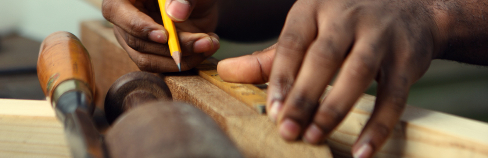 Person measuring with a pencil 