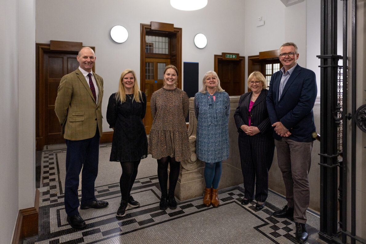 GPA customers in Whitehall - a group of colleagues standing getting their photograph taken.