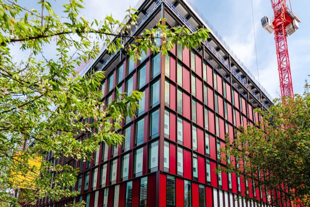 Our Government Hub at 2 Ruskin Square in Croydon, London, generates solar gain through the building facades. These are panels of glass placed vertically up the sides of the building which are separated by red vertical panels.