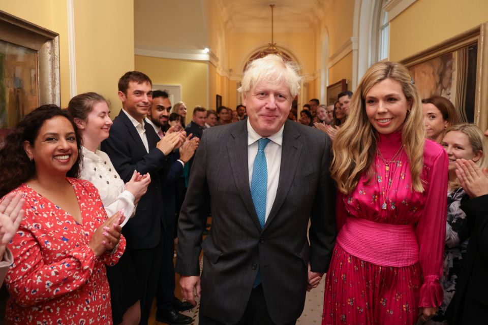 Prime Minister Boris Johnson, accompanied by his wife Carrie, departs No.10 Downing Street.
